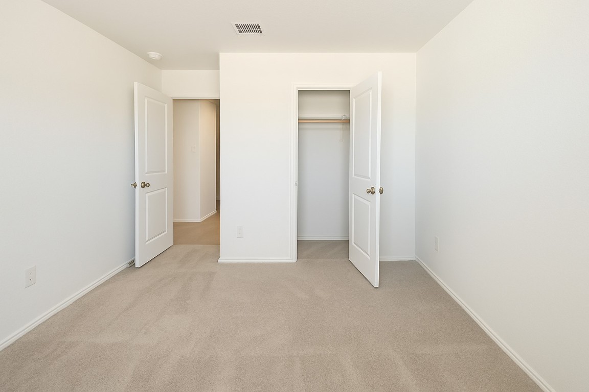 461 Whoopers Loop Uhland, TX 78640 - Photo 5 of 12 an empty room with closet area