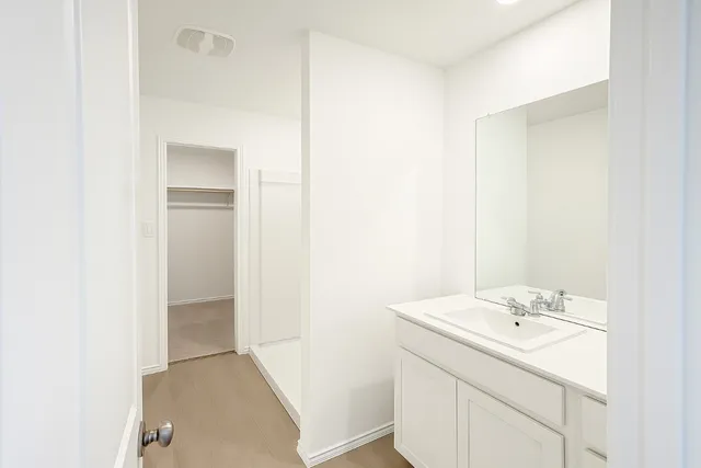 an empty room with closet area