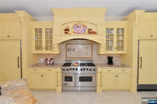 a kitchen with a stove and a sink