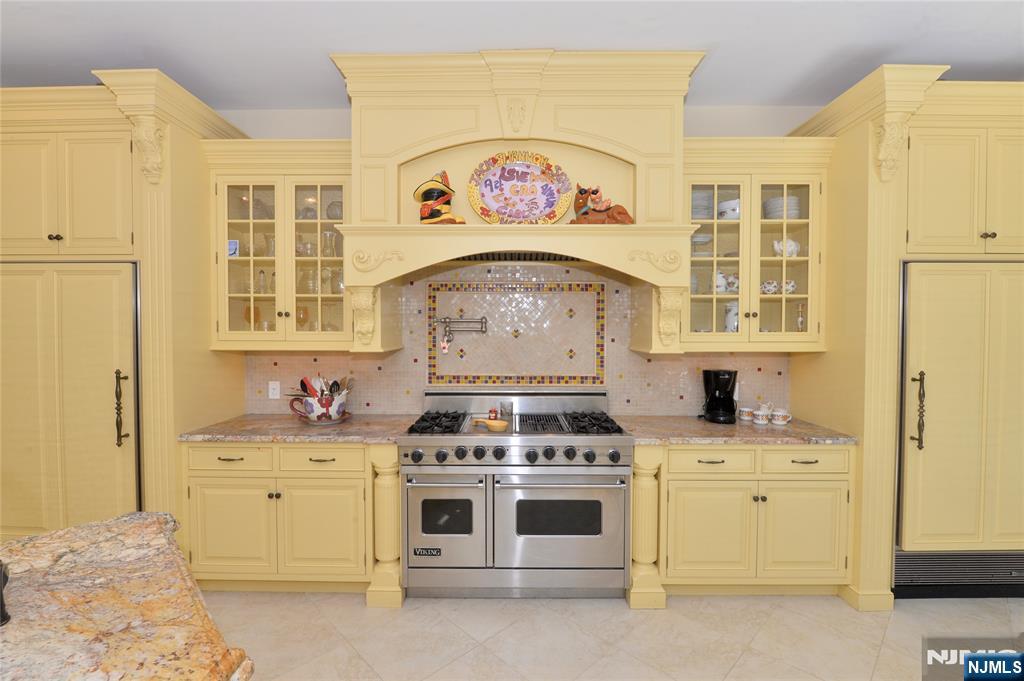 14 Werimus Brook Road Saddle River, NJ 07458 - Photo 16 of 50 a kitchen with a stove and a sink