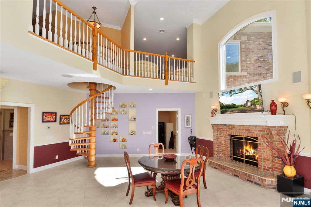 14 Werimus Brook Road Saddle River, NJ 07458 - Photo 19 of 50 a view of a livingroom with furniture and a fireplace