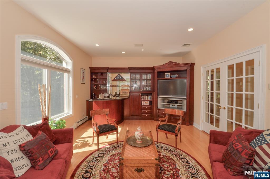 14 Werimus Brook Road Saddle River, NJ 07458 - Photo 25 of 50 a living room with furniture and a window