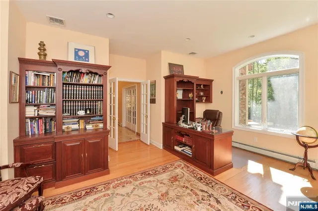 a open kitchen with stainless steel appliances granite countertop a stove and a refrigerator