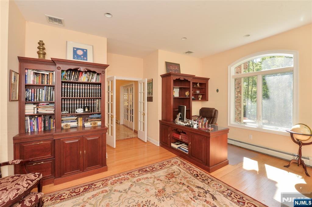 14 Werimus Brook Road Saddle River, NJ 07458 - Photo 31 of 50 a open kitchen with stainless steel appliances granite countertop a stove and a refrigerator