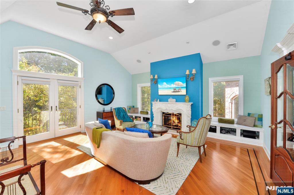 14 Werimus Brook Road Saddle River, NJ 07458 - Photo 34 of 50 a living room with fireplace furniture and a large window