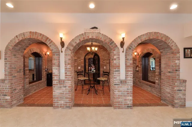 a view of hall way with furniture