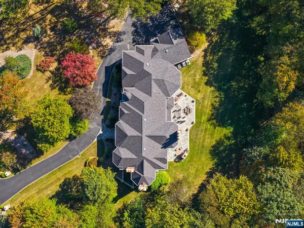 a aerial view of a house with a yard and garden