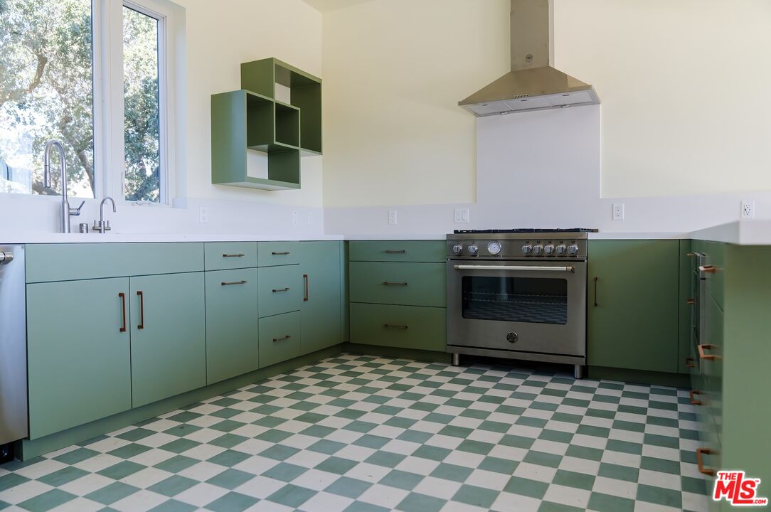27349 Old Chimney Road Malibu, CA 90265 - Photo 3 of 9 a kitchen with a cabinets and a stove