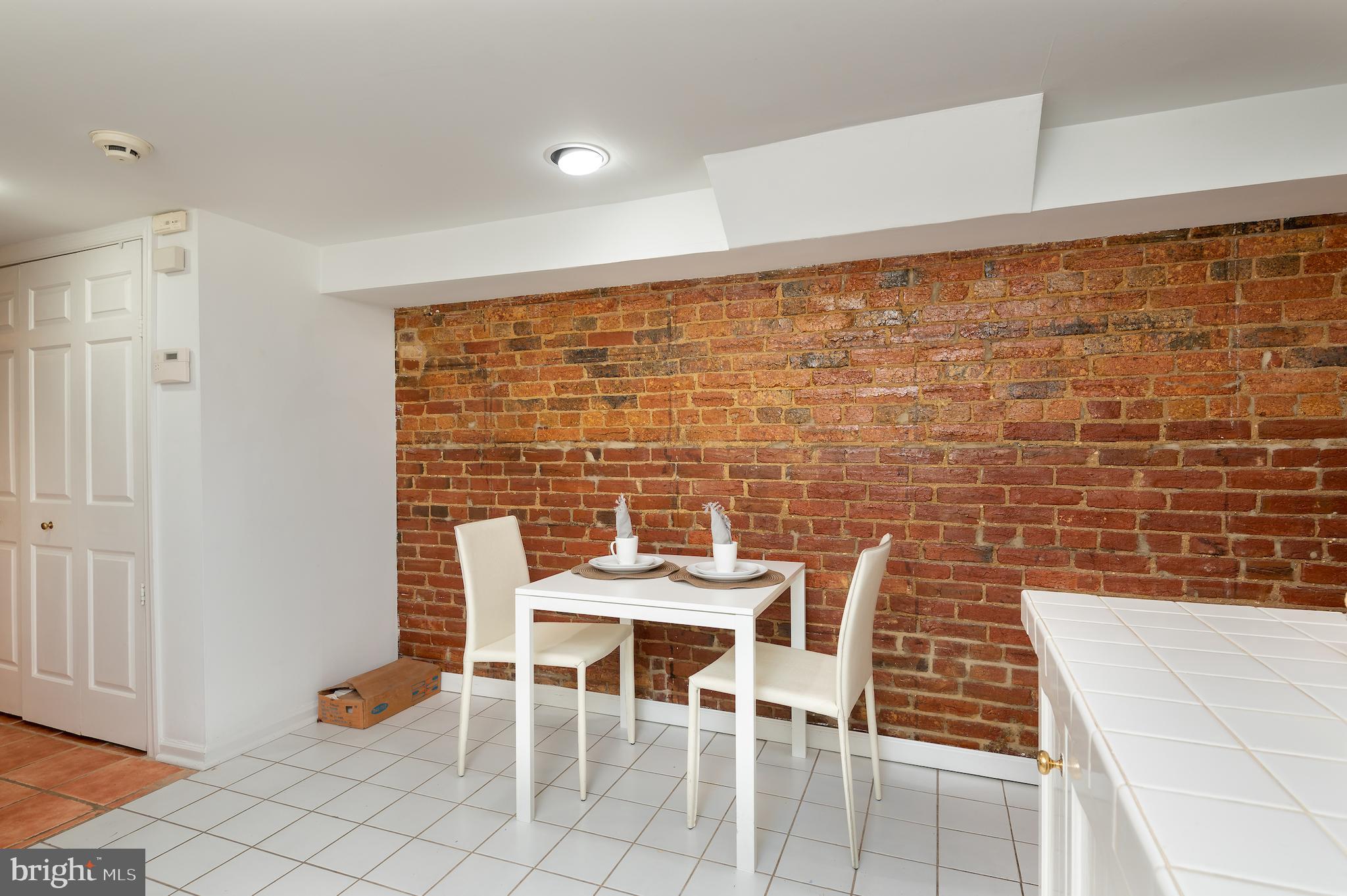 721 A Street Southeast Washington, DC 20003 - Photo 37 of 46 Exposed brick in kitchen of apt