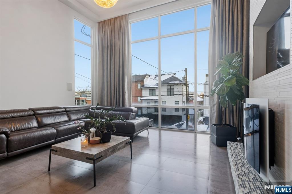 760 Undercliff Avenue, Unit B Edgewater, NJ 07020 - Photo 14 of 49 a living room with furniture and a fireplace