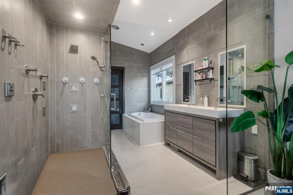 760 Undercliff Avenue, Unit B Edgewater, NJ 07020 - Photo 34 of 49 a bathroom with a double vanity sink toilet and shower