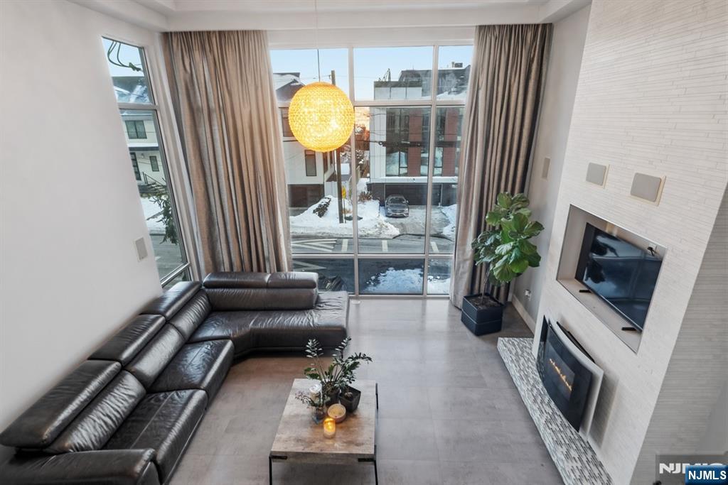 760 Undercliff Avenue, Unit B Edgewater, NJ 07020 - Photo 4 of 49 a living room with furniture and a fireplace