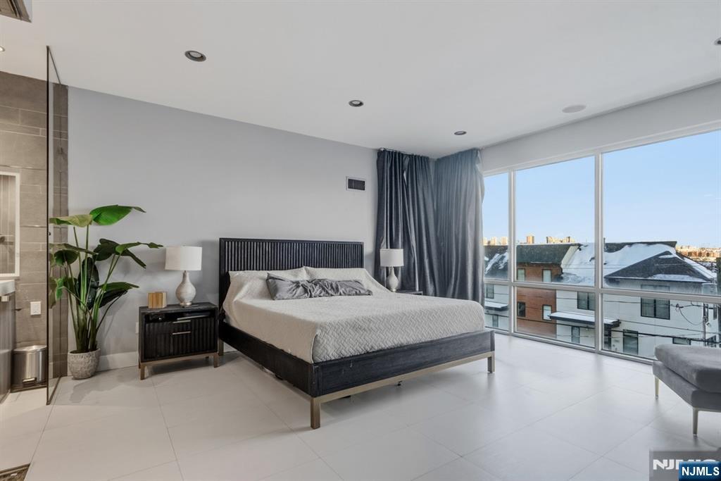 760 Undercliff Avenue, Unit B Edgewater, NJ 07020 - Photo 46 of 49 a bedroom with a bed furniture and a potted plant