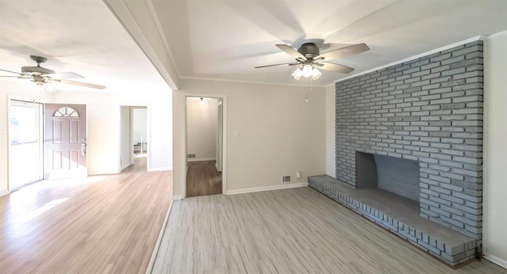 4045 Compton Circle Powder Springs, GA 30127 - Photo 17 of 54 a view of a livingroom with wooden floor and a ceiling fan