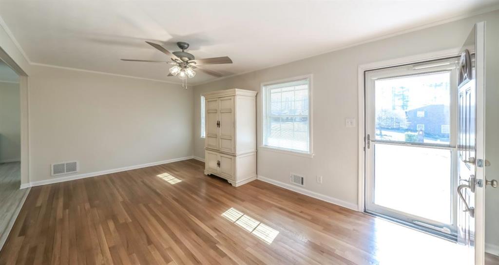 4045 Compton Circle Powder Springs, GA 30127 - Photo 18 of 54 wooden floor in an empty room with a window