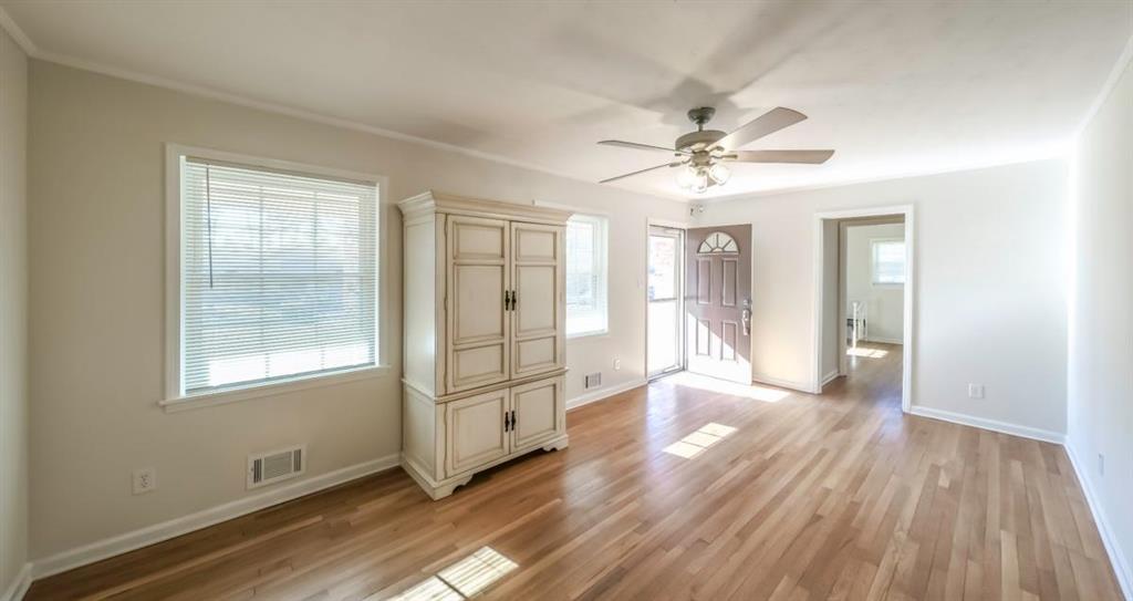4045 Compton Circle Powder Springs, GA 30127 - Photo 19 of 54 wooden floor in an empty room with a window
