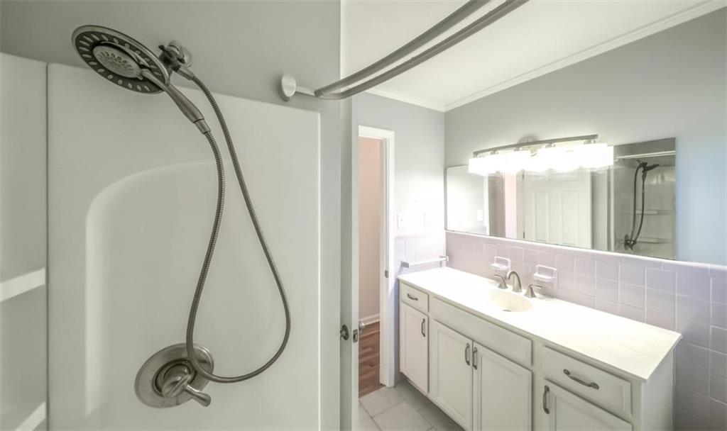 4045 Compton Circle Powder Springs, GA 30127 - Photo 20 of 54 a bathroom with a sink vanity and a mirror