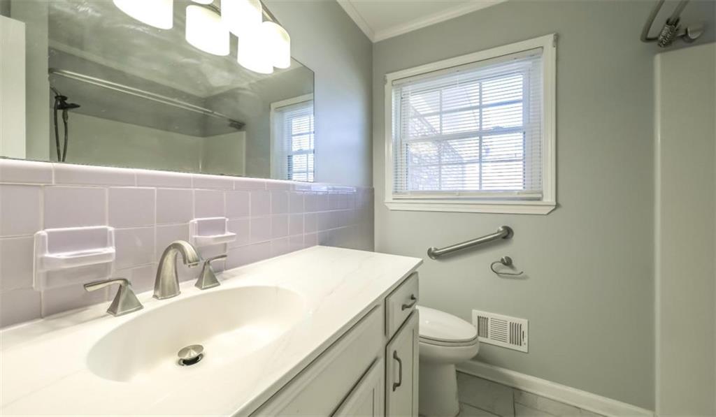 4045 Compton Circle Powder Springs, GA 30127 - Photo 21 of 54 a bathroom with a sink and a toilet