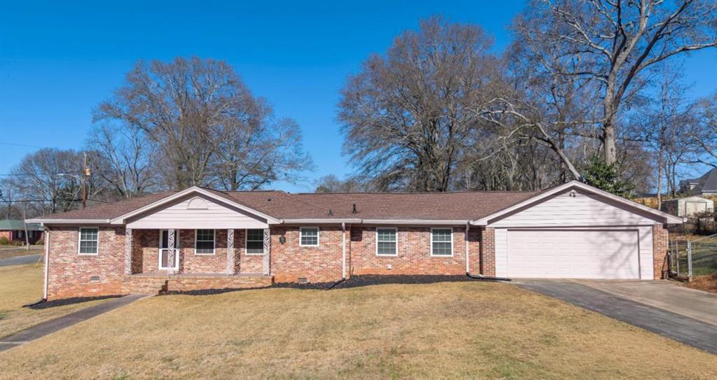 4045 Compton Circle Powder Springs, GA 30127 - Photo 3 of 54 a front view of a house with a yard and garage