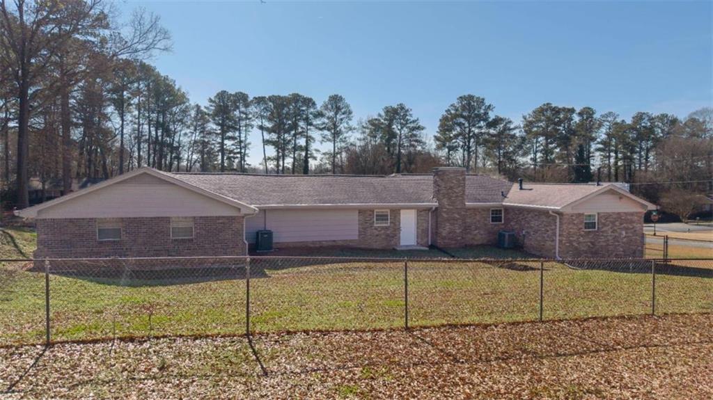 4045 Compton Circle Powder Springs, GA 30127 - Photo 5 of 54 a front view of a house with a yard