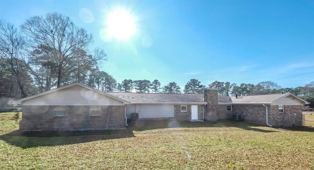 4045 Compton Circle Powder Springs, GA 30127 - Photo 51 of 54 a view of a house with a yard and large tree
