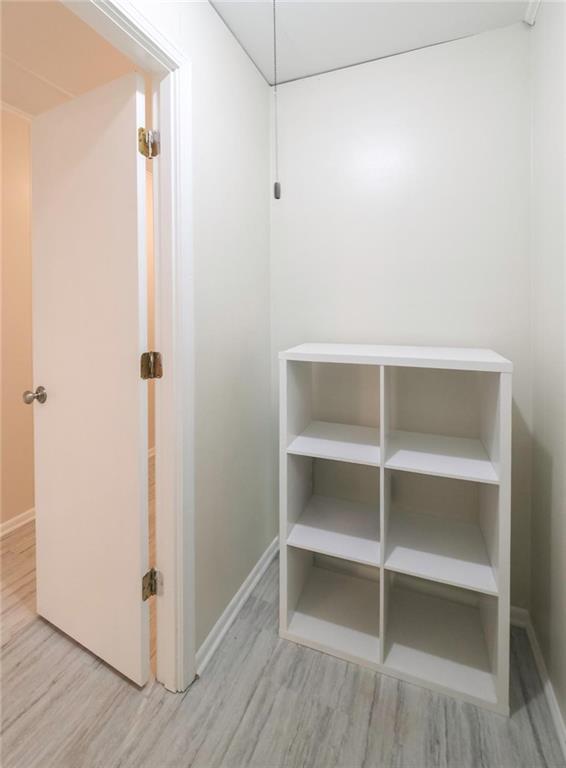 4045 Compton Circle Powder Springs, GA 30127 - Photo 52 of 54 a view of walk in closet with empty racks
