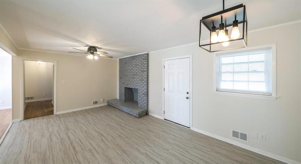 4045 Compton Circle Powder Springs, GA 30127 - Photo 10 of 54 an empty room with wooden floor mirror and windows