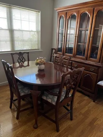 a view of a dining room with furniture and window