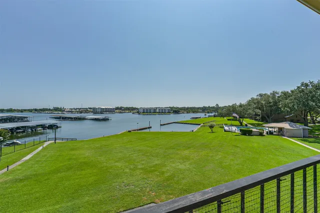 a view of a lake with a big yard