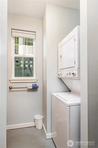 a utility room with a window dryer and washer
