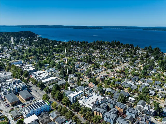an aerial view of residential building and ocean