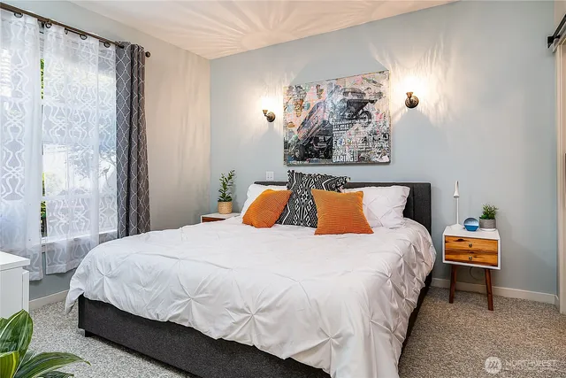 a bedroom with bed and window