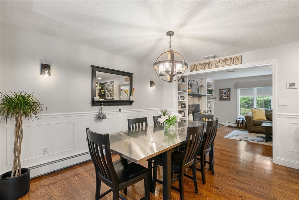 12 Nancy Road Natick, MA 01760 - Photo 4 of 25 a view of a dining room with furniture window and wooden floor