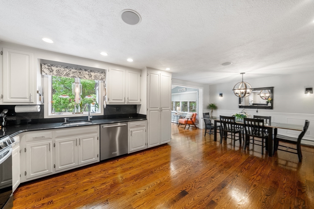 12 Nancy Road Natick, MA 01760 - Photo 5 of 25 a kitchen with lots of counter top space and dining table
