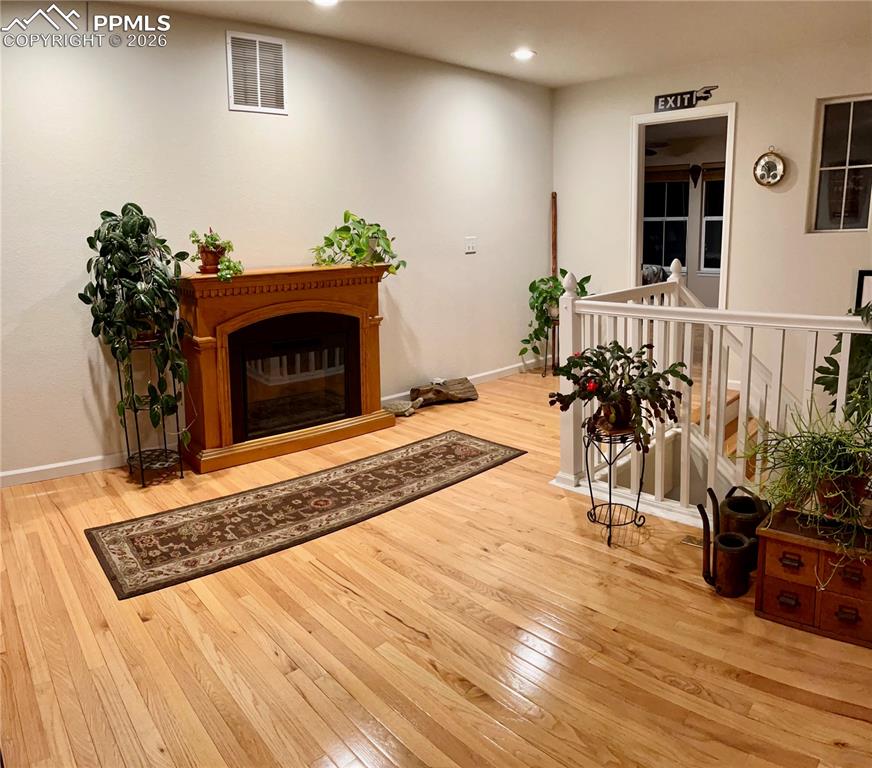 17063 Blue Mist Grove Monument, CO 80132 - Photo 13 of 33 a living room with furniture and a fireplace
