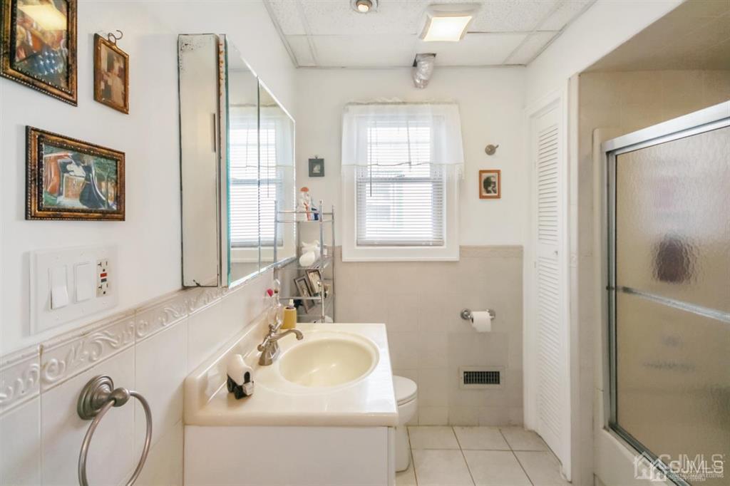 122 South Lincoln Avenue Middlesex, NJ 08846 - Photo 14 of 37 a bathroom with a sink a toilet and shower
