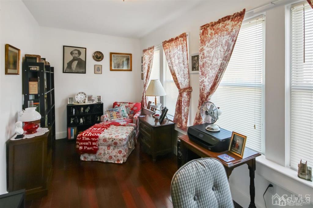 122 South Lincoln Avenue Middlesex, NJ 08846 - Photo 15 of 37 a bedroom with furniture and a wooden floor