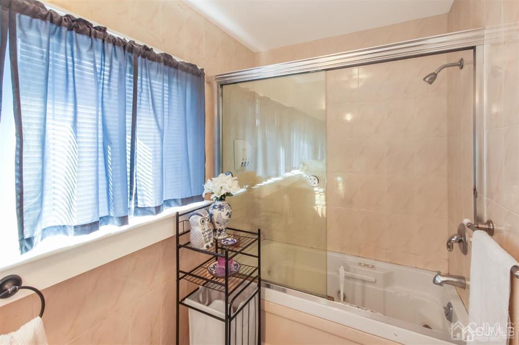 122 South Lincoln Avenue Middlesex, NJ 08846 - Photo 20 of 37 a bathroom with a bathtub and a shower
