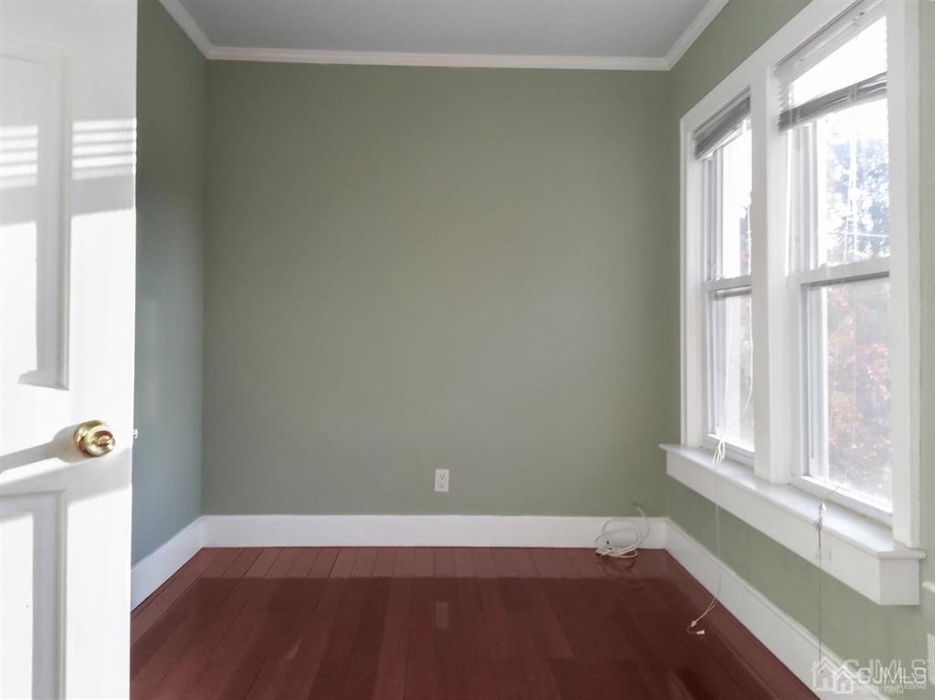122 South Lincoln Avenue Middlesex, NJ 08846 - Photo 28 of 37 an empty room with wooden floor and windows