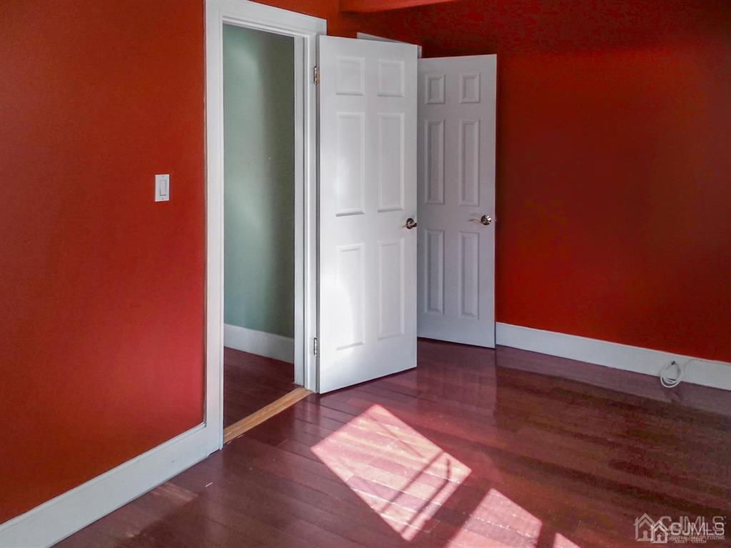 122 South Lincoln Avenue Middlesex, NJ 08846 - Photo 29 of 37 an empty room with wooden floor and entrance