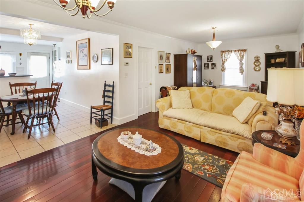 122 South Lincoln Avenue Middlesex, NJ 08846 - Photo 4 of 37 a living room with furniture and a wooden floor