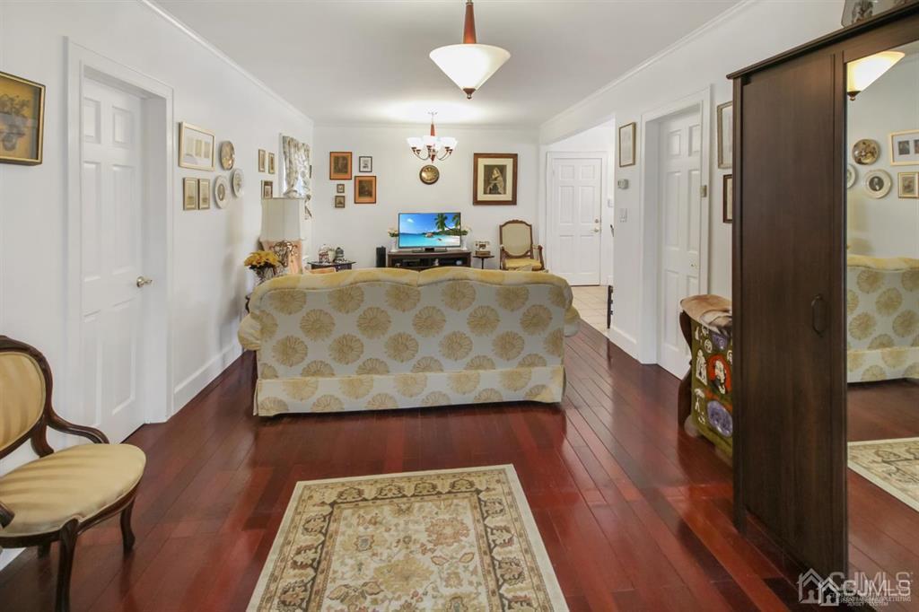 122 South Lincoln Avenue Middlesex, NJ 08846 - Photo 5 of 37 a view of hallway with furniture and a rug