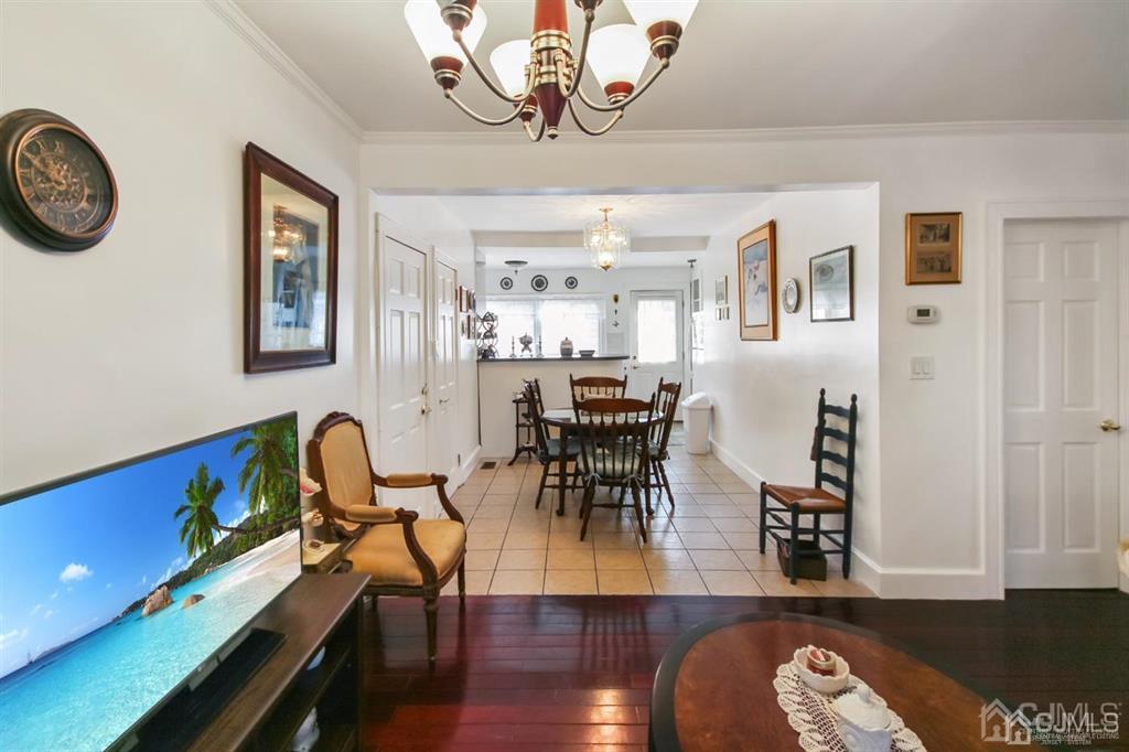 122 South Lincoln Avenue Middlesex, NJ 08846 - Photo 6 of 37 a view of a dining room with furniture and wooden floor