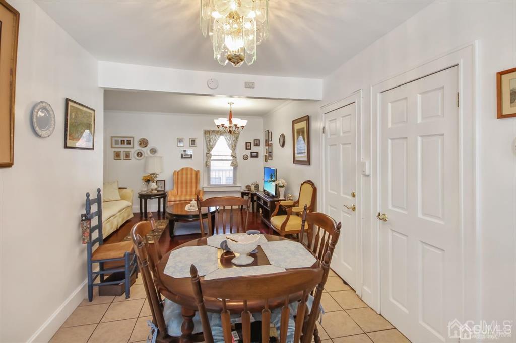 122 South Lincoln Avenue Middlesex, NJ 08846 - Photo 7 of 37 a dining room with furniture and chandelier