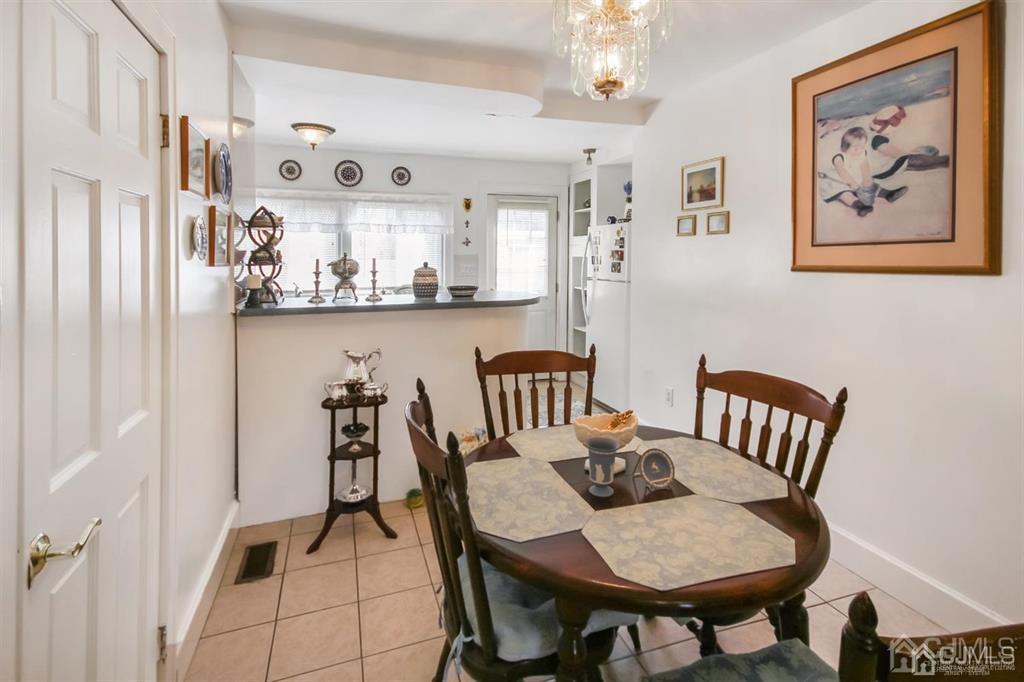 122 South Lincoln Avenue Middlesex, NJ 08846 - Photo 8 of 37 a view of a dining room with furniture and chandelier