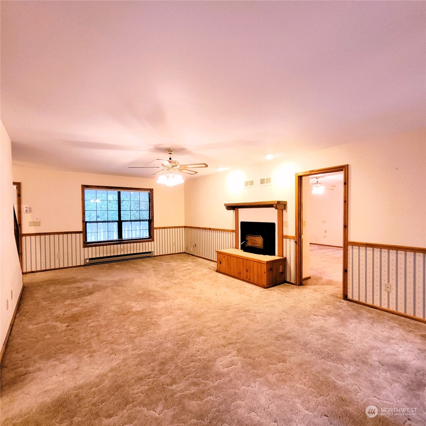 2712 Atterberry Road Sequim, WA 98382 - Photo 3 of 39 en empty room with windows and fireplace