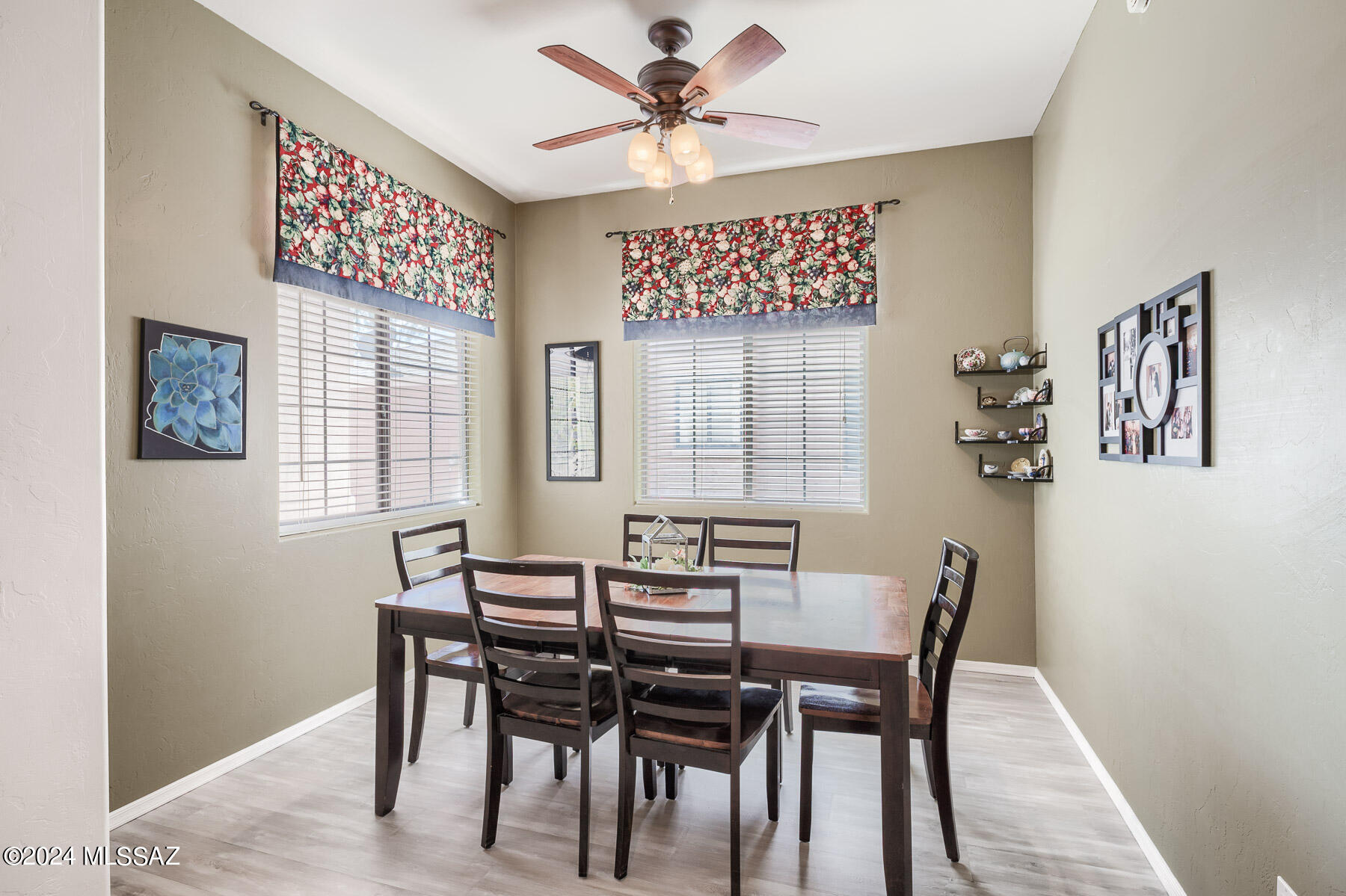9141 East Dawn Post Road Tucson, AZ 85749 - Photo 10 of 24 a view of a dining room with furniture and a chandelier