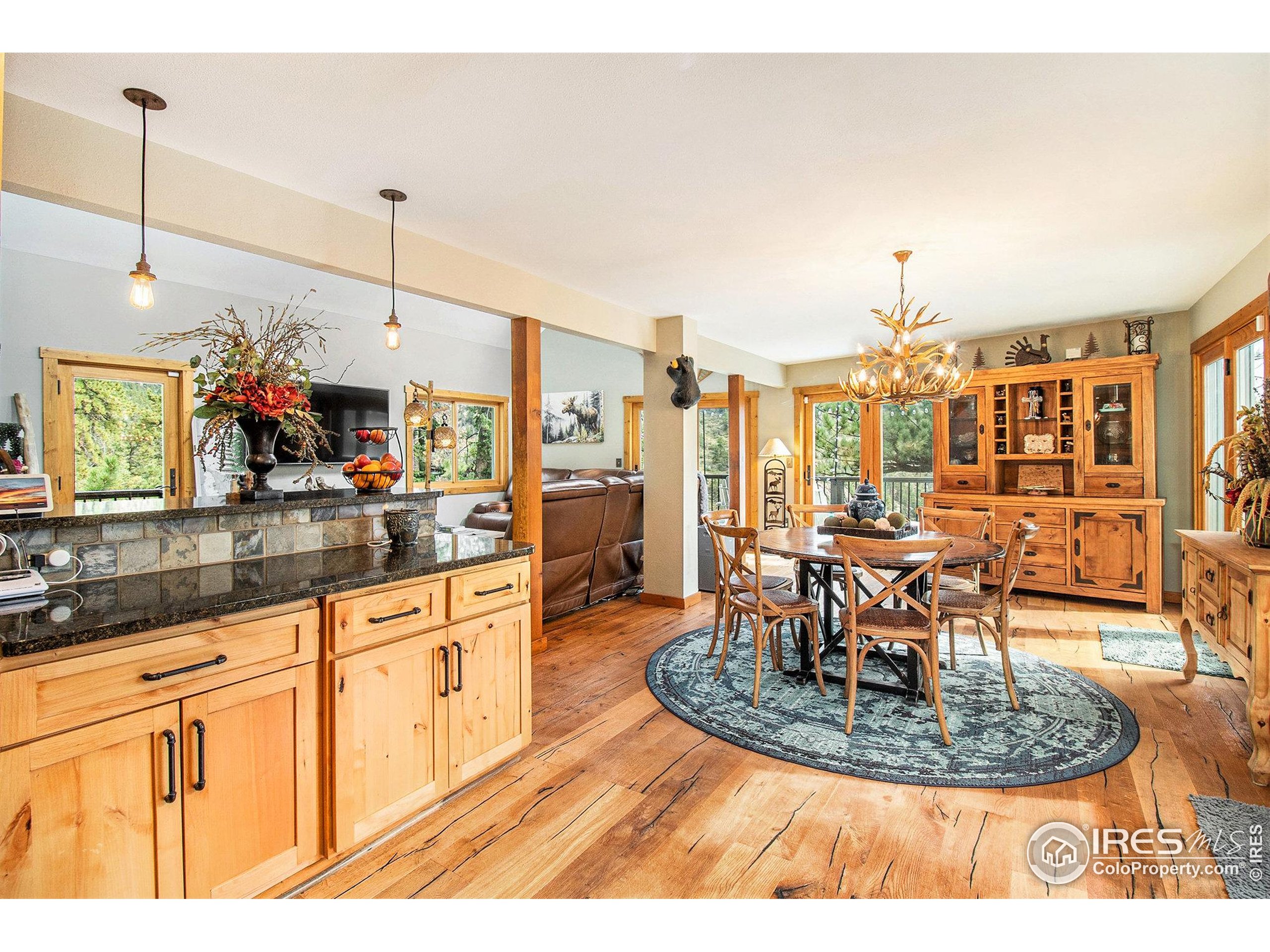 a view of a living room and kitchen