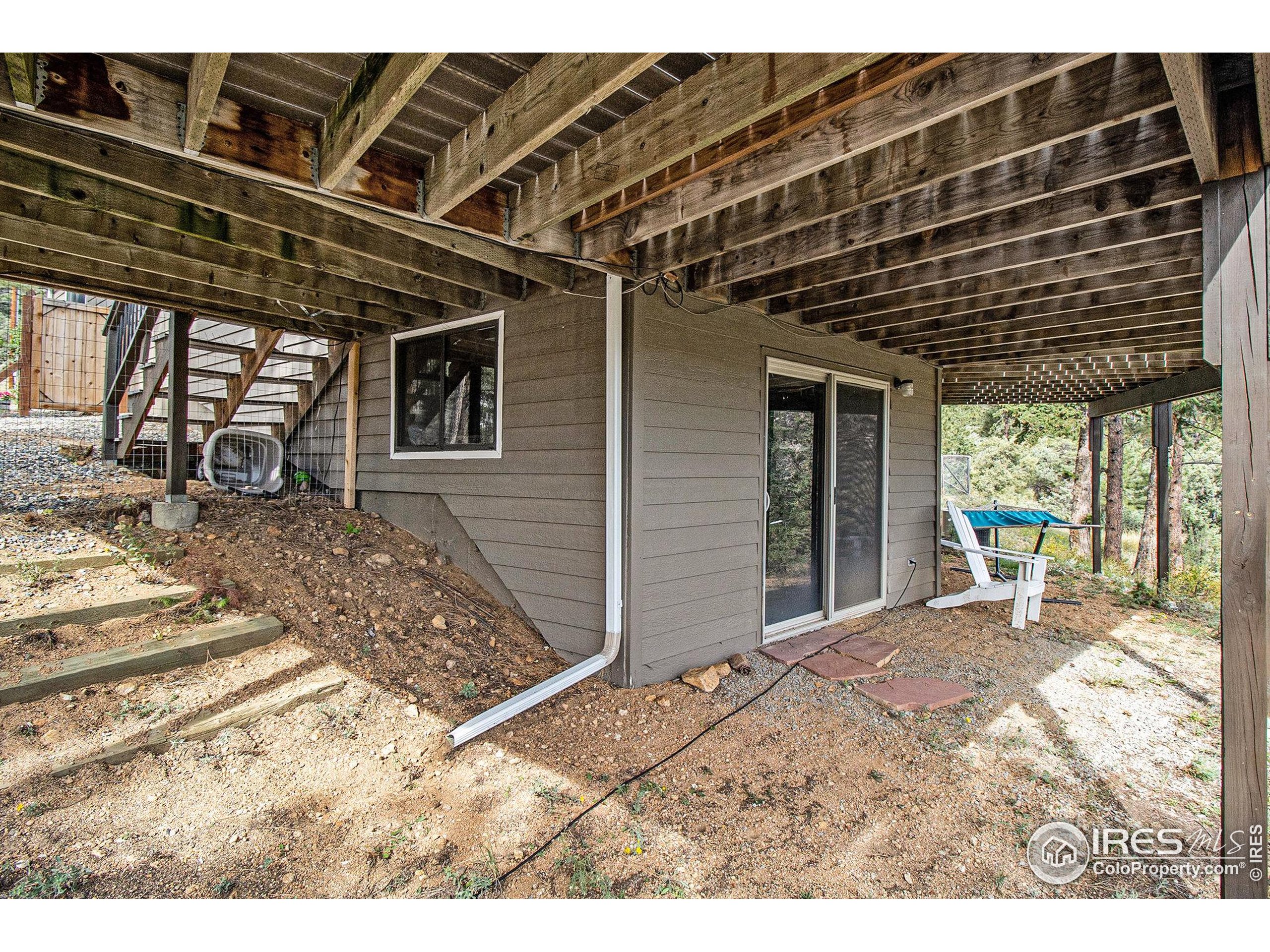 270 Choctaw Road Lyons, CO 80540 - Photo 24 of 26 a backyard of a house with table and chairs