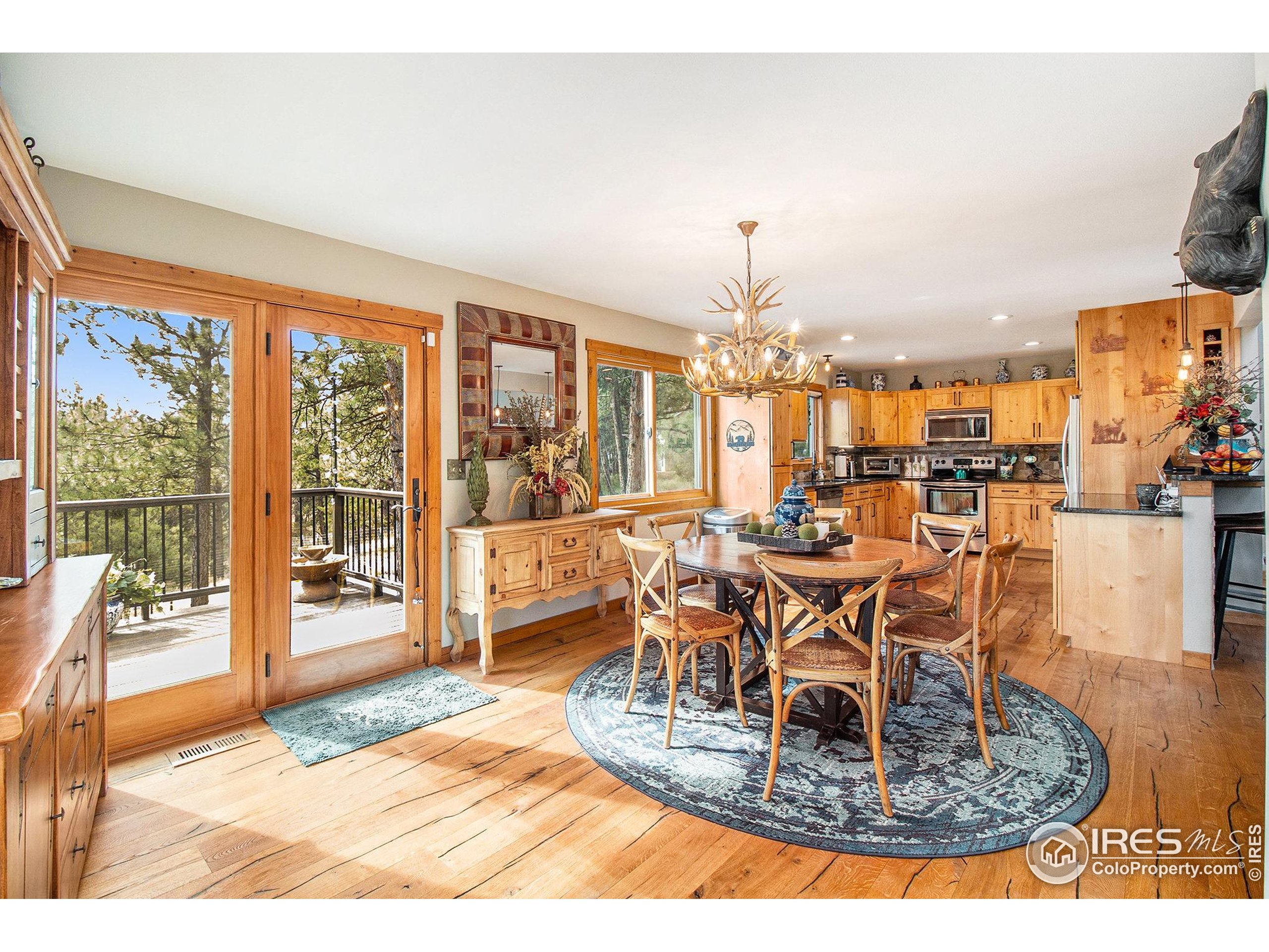 270 Choctaw Road Lyons, CO 80540 - Photo 7 of 26 a view of a dining room with furniture water view and kitchen view